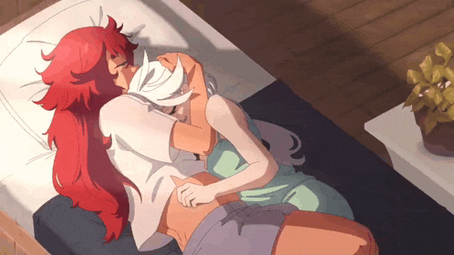 a couple of anime characters laying on a bed hugging and kissing