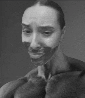 a black and white photo of a woman with a black mask on her face .