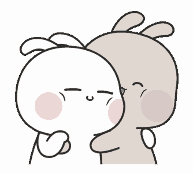 a couple of rabbits are hugging each other and one is kissing the other