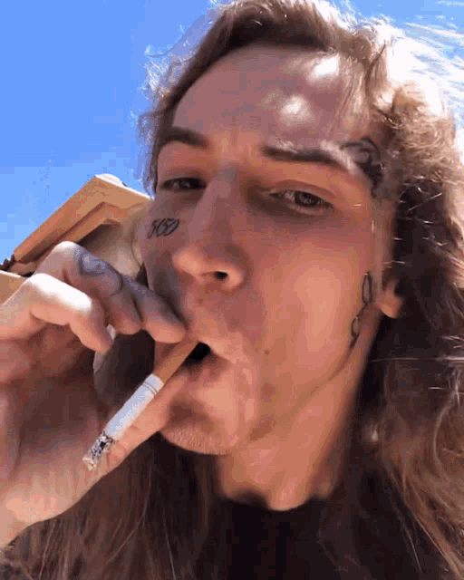 a man with a tattoo on his face that says rsd