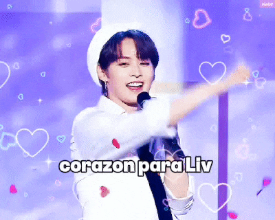 a young man singing into a microphone with the words " corazon para liv " written on the bottom