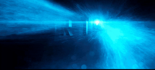 a blue light is coming out of a dark room