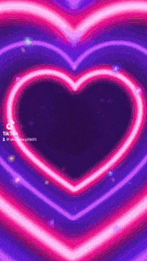 a purple background with a neon heart in the middle .