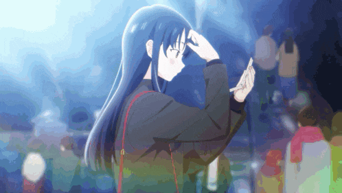a girl with long blue hair is holding a piece of paper in her hand