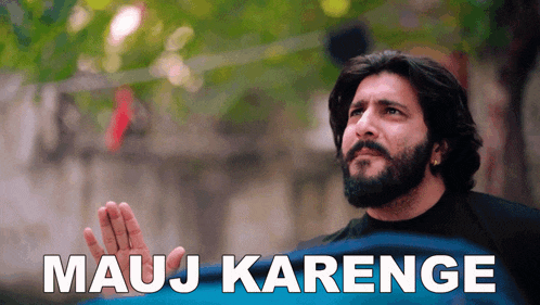 a man with a beard holds his hand up in front of the words mauj karenge