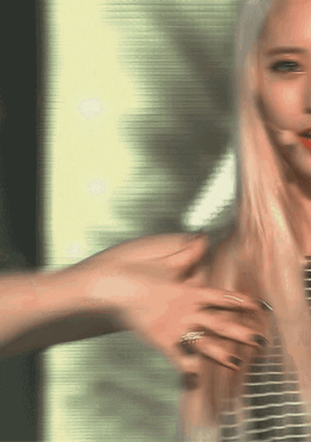 a blurry picture of a woman 's face with a green background