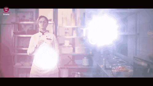 a woman in a chef 's uniform is standing in a kitchen with a light coming out of her hand ..