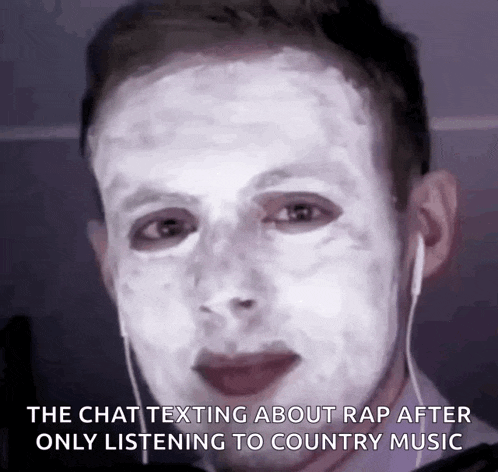 a man with a white face is listening to country music while texting about rap .