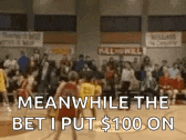 a group of people are playing basketball in a gym and a crowd is watching .