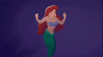 ariel from the little mermaid is swimming in the ocean and crying .