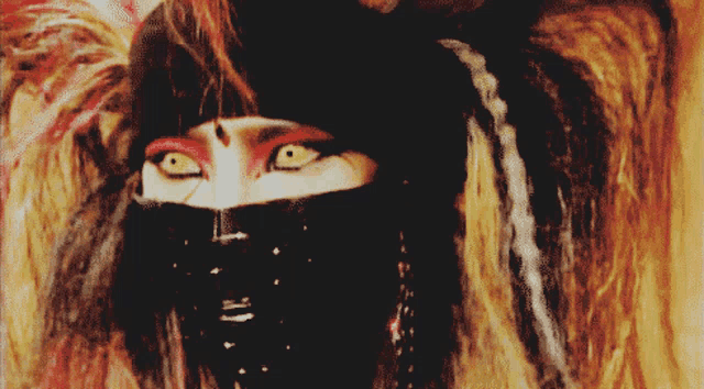 a close up of a woman 's face with a black mask