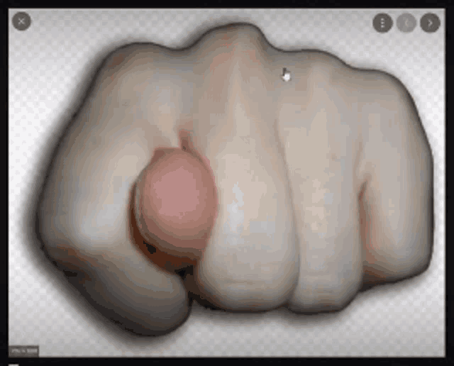 a close up of a person 's fist with the thumb pointing at the camera
