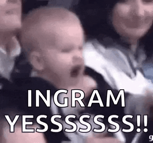 a baby is being held in a woman 's arms and the baby is screaming .