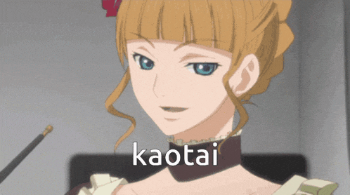 a woman with blonde hair and blue eyes has kaotai written on her chest