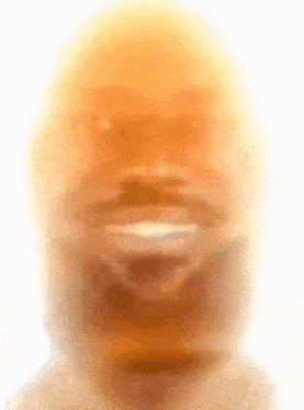 a blurry picture of a man 's face with a beard .