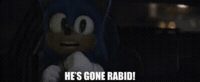 a man is standing in a dark room and says he 's gone rabid