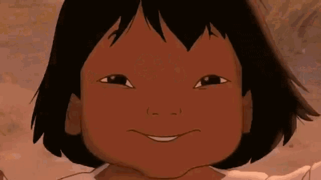 a close up of a cartoon girl 's face smiling .