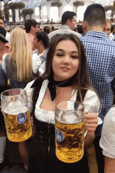a woman is holding two mugs of beer with hb written on them