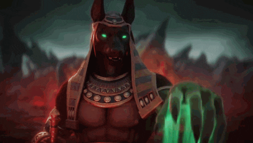 a statue of an anubis with green eyes is holding a green object