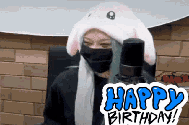 a person wearing a bunny hat and a mask with a happy birthday sticker