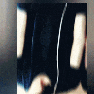 a blurry picture of a person 's arm with headphones on