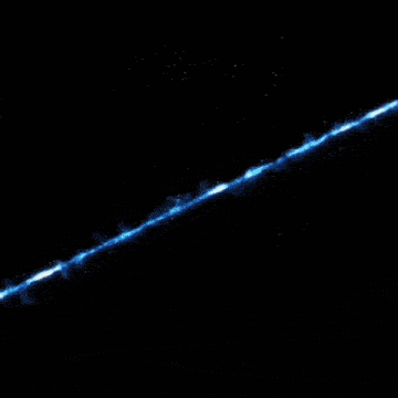 a blue and white flame is coming out of the ground
