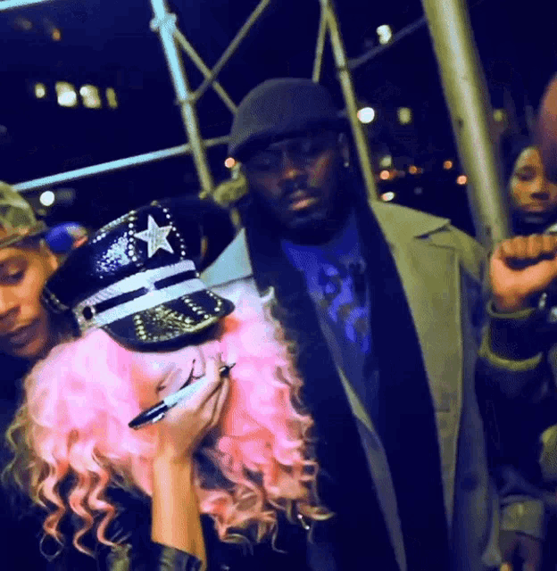 a woman with pink hair is wearing a police hat with a star on it