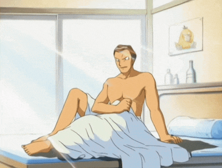 a shirtless man sits on a bed with a picture of a duck above him