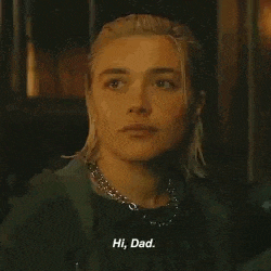a close up of a woman 's face with the words `` hi , dad '' on it .