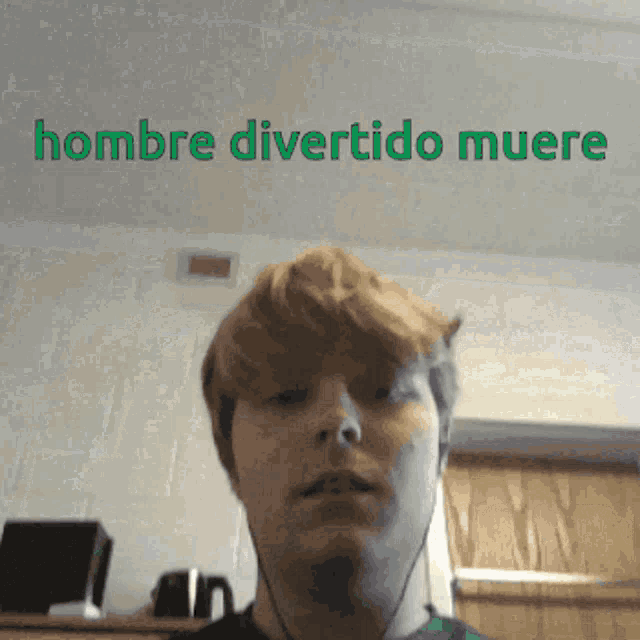 a man is wearing headphones and has the words hombre divertido muere above his head