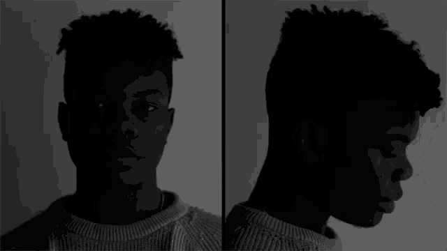 a black and white photo of a young man 's face
