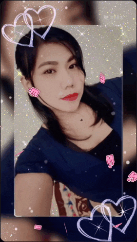 a woman in a blue shirt takes a selfie with hearts around her head
