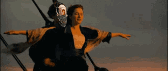 a man and a woman on a boat with a cross on their head