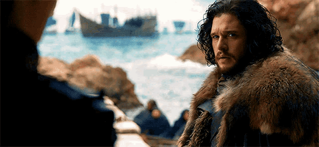 a man in a fur coat stands in front of a boat