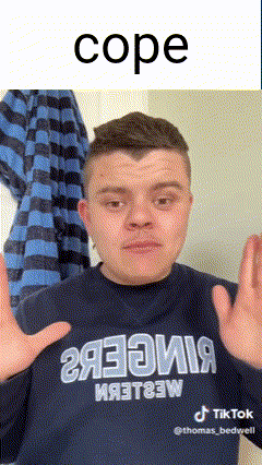 a young man wearing a blue shirt that says cope