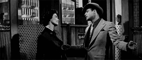 a black and white photo of a man and a woman