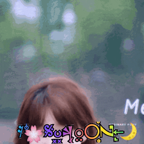 a woman 's face is shown with a sticker that says " moon "