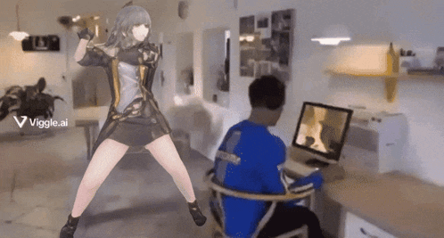 a woman is dancing in front of a man sitting at a desk in front of a computer screen with the words viggle.ai visible