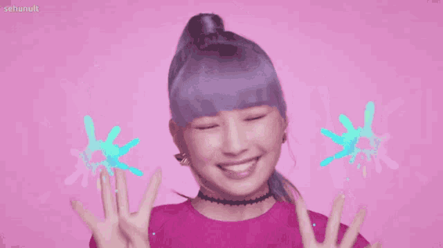 a woman with purple hair is wearing a pink sweater and choker