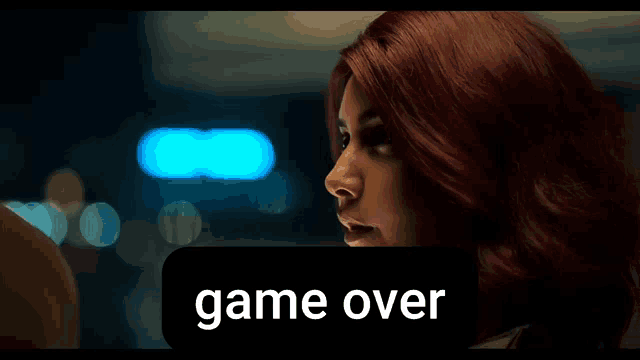 a close up of a woman with red hair and the word game over behind her