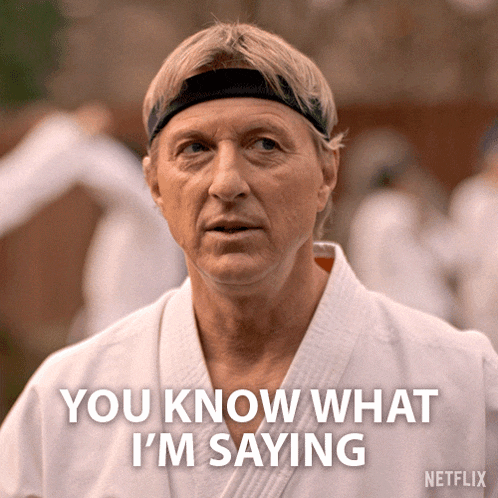a man wearing a headband says you know what i 'm saying