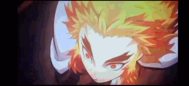 a close up of a person 's face with fire coming out of their hair .