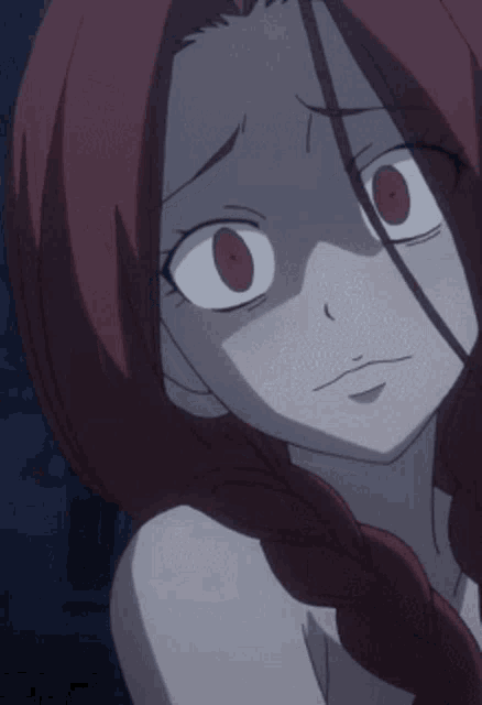 a close up of a girl with red hair making a silly face