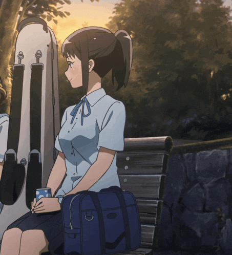 a girl sits on a bench holding a cup and a blue bag