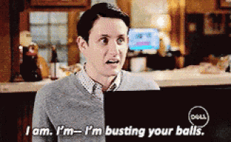 a man sitting in front of a dell computer says i am i 'm busting your balls