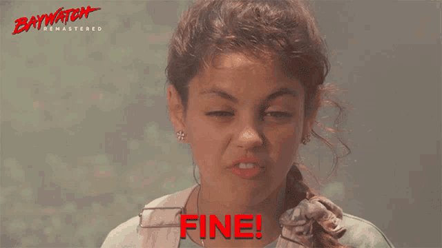 a woman making a funny face with the word fine on the bottom
