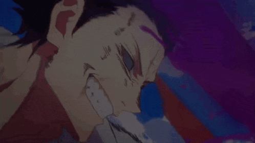 a close up of a person 's face with blood coming out of his mouth .