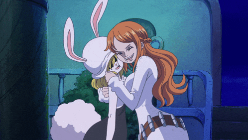 a woman in a bunny costume is hugging another woman in a white outfit
