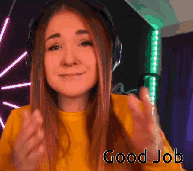 a woman wearing headphones giving a thumbs up with the words good job below her