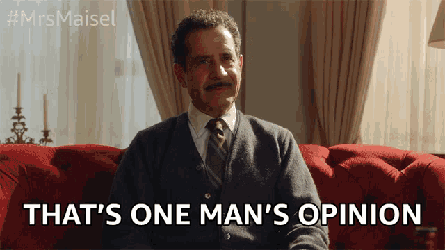a man sitting on a red couch with the words that 's one man 's opinion below him